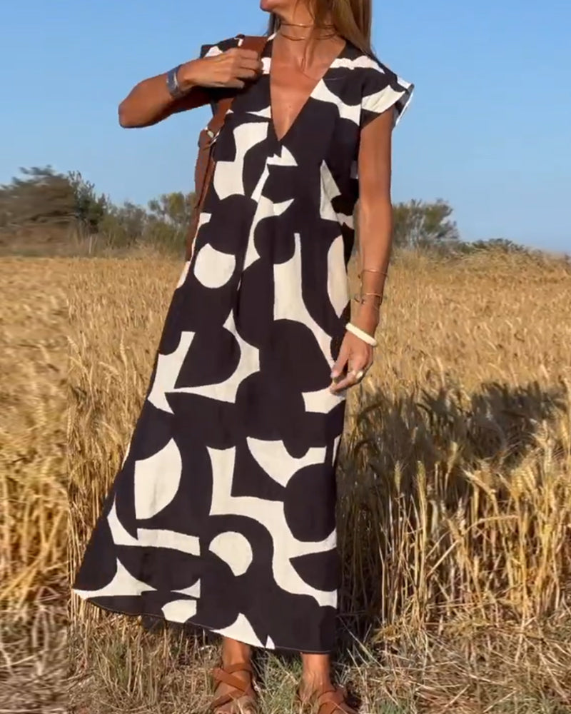 NAOMI™ | Abito Lungo Stampato con Scollo a V e Linea Svasata per un Look Estivo