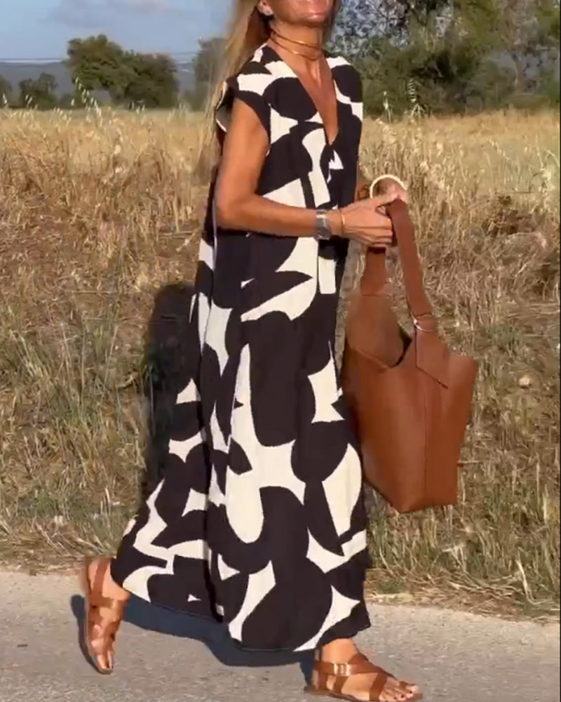 NAOMI™ | Abito Lungo Stampato con Scollo a V e Linea Svasata per un Look Estivo